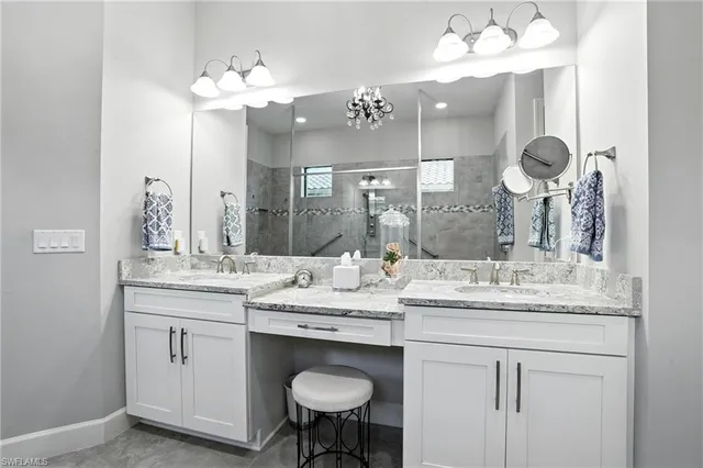 a bathroom with a sink double vanity and a mirror