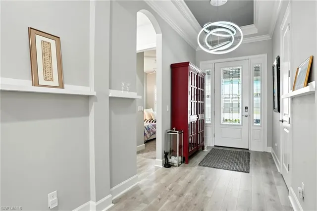 a view of empty room with window and ceiling fan