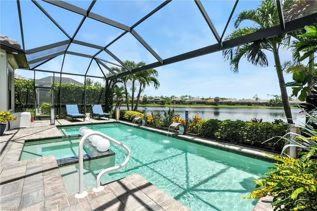 a view of a swimming pool and lounge chairs