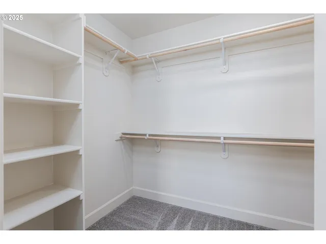 a view of an empty walk in closet