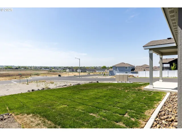 a view of a lake with a yard