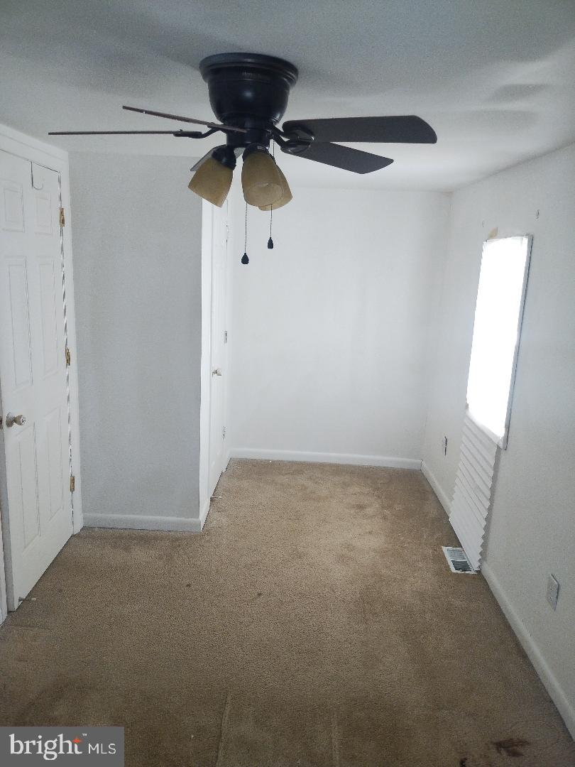 2608 Sansbury Road Upper Marlboro, MD 20774 - Photo 12 of 41 an empty room with windows
