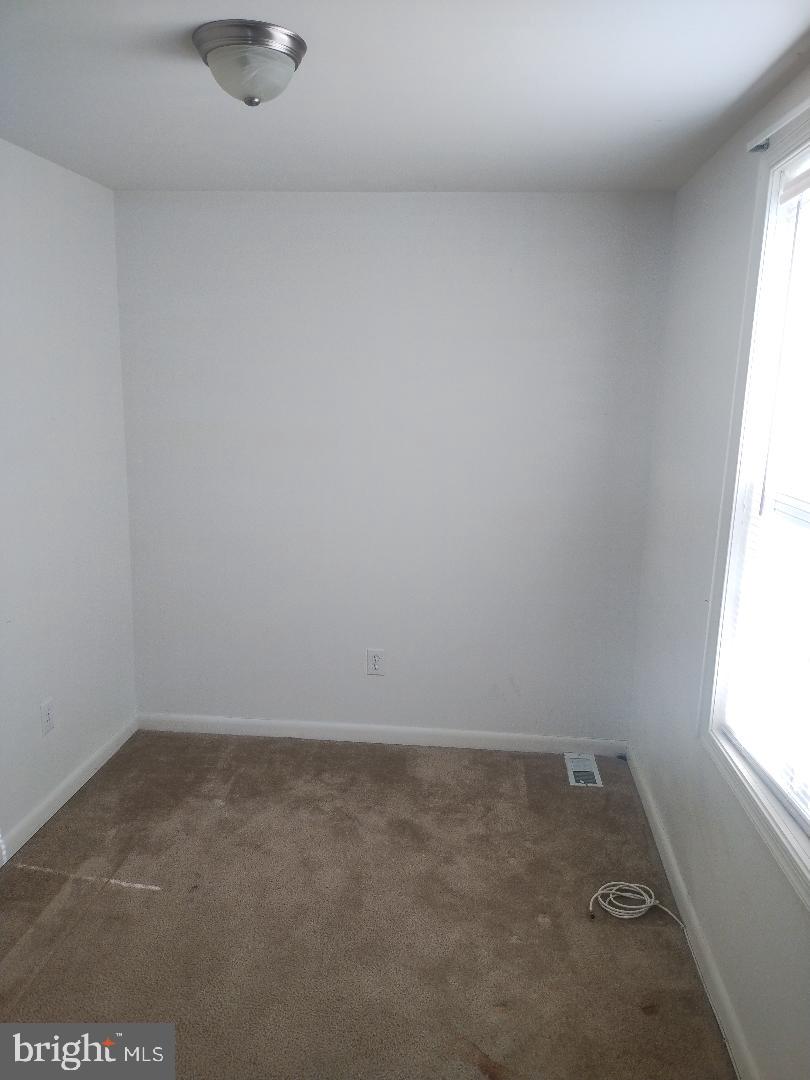 2608 Sansbury Road Upper Marlboro, MD 20774 - Photo 14 of 41 an empty room with a window