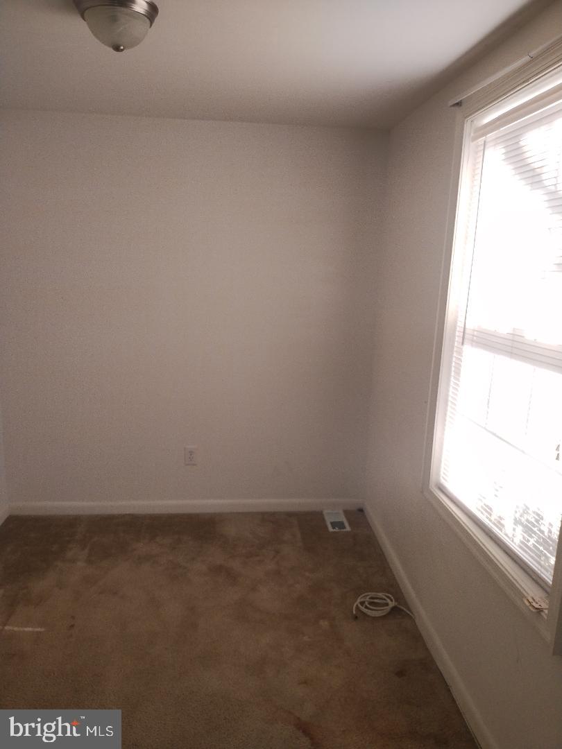 2608 Sansbury Road Upper Marlboro, MD 20774 - Photo 15 of 41 an empty room with a window