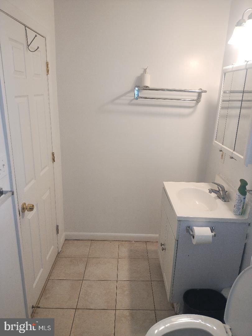 2608 Sansbury Road Upper Marlboro, MD 20774 - Photo 17 of 41 a bathroom with a sink toilet and shower