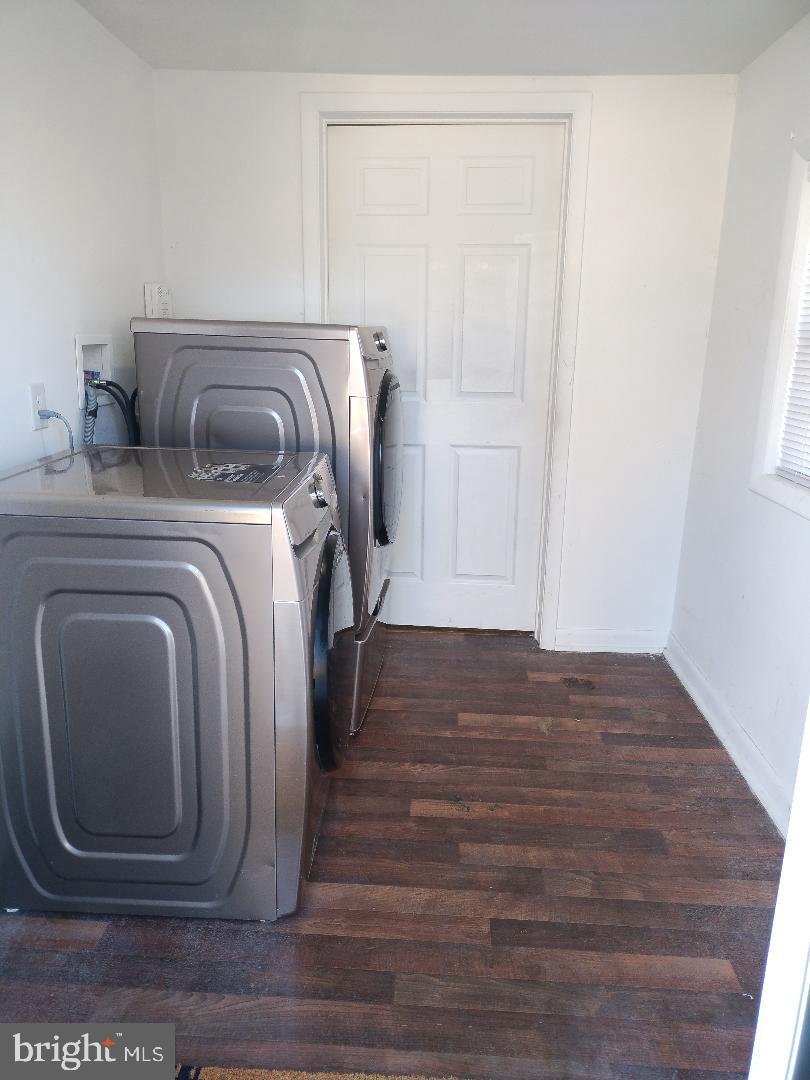 2608 Sansbury Road Upper Marlboro, MD 20774 - Photo 29 of 41 a utility room with wooden floor washer and dryer