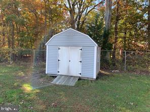 2608 Sansbury Road Upper Marlboro, MD 20774 - Photo 37 of 41 a view of backyard with barn and a large tree