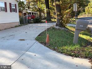 2608 Sansbury Road Upper Marlboro, MD 20774 - Photo 4 of 41 a front view of a house with a yard and tree