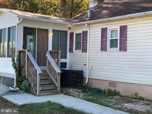 2608 Sansbury Road Upper Marlboro, MD 20774 - Photo 6 of 41 a view of a house with wooden deck and a yard