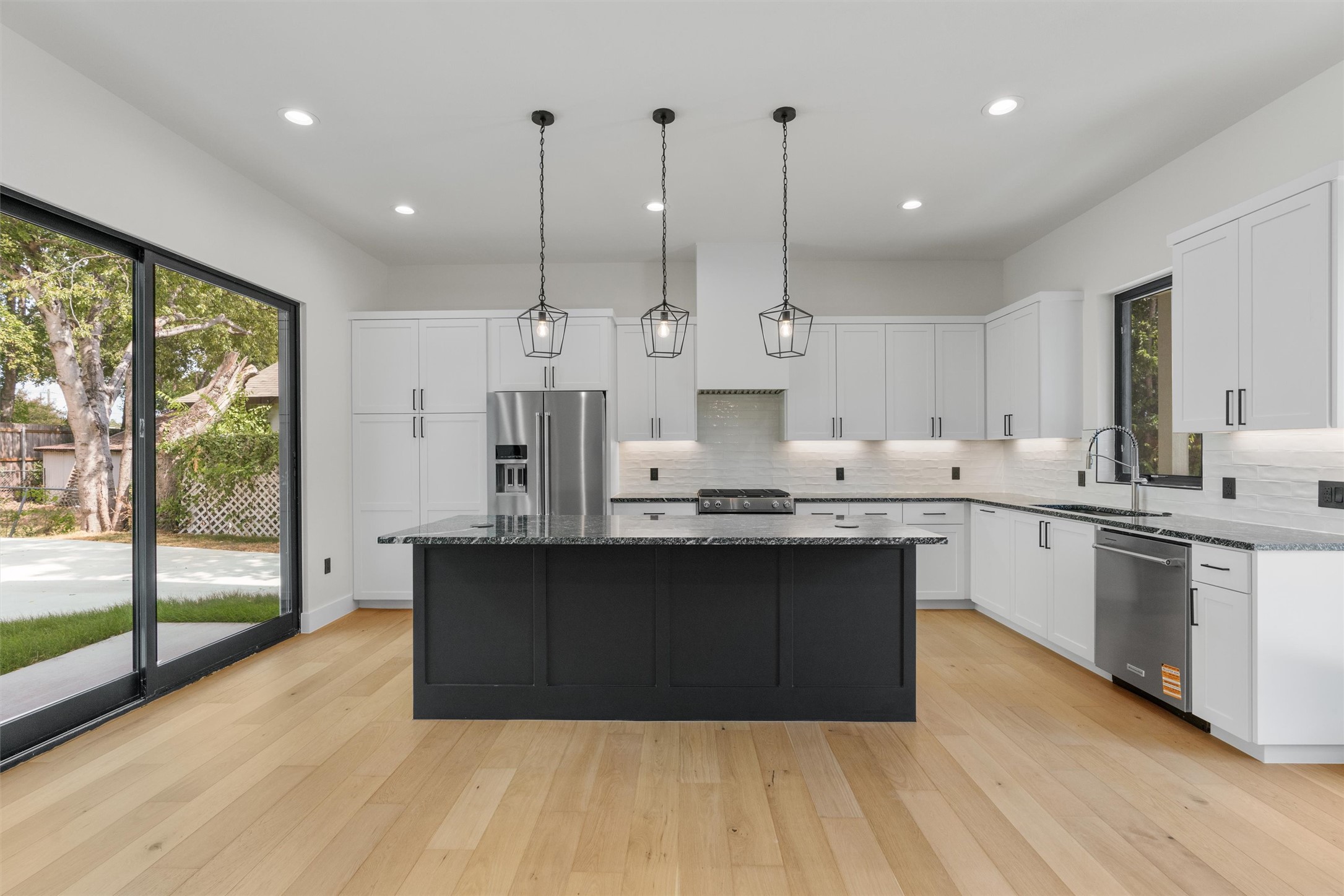 818 Stark Street, Unit A Austin, TX 78756 - Photo 8 of 36 Kitchen island equipped with pop up outlets and cell phone chargers