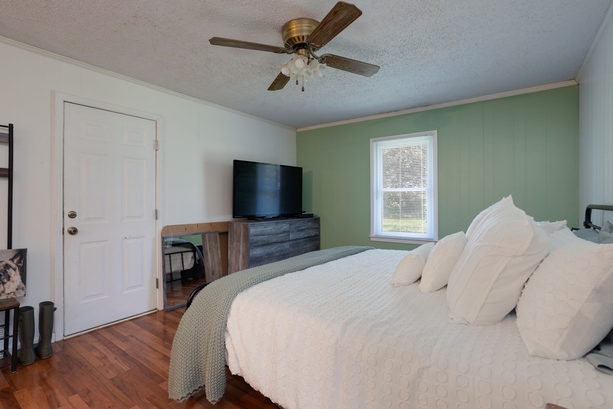 1151 Fowler Ford Road Portland, TN 37148 - Photo 23 of 35 a bedroom with a bed and a flat screen tv