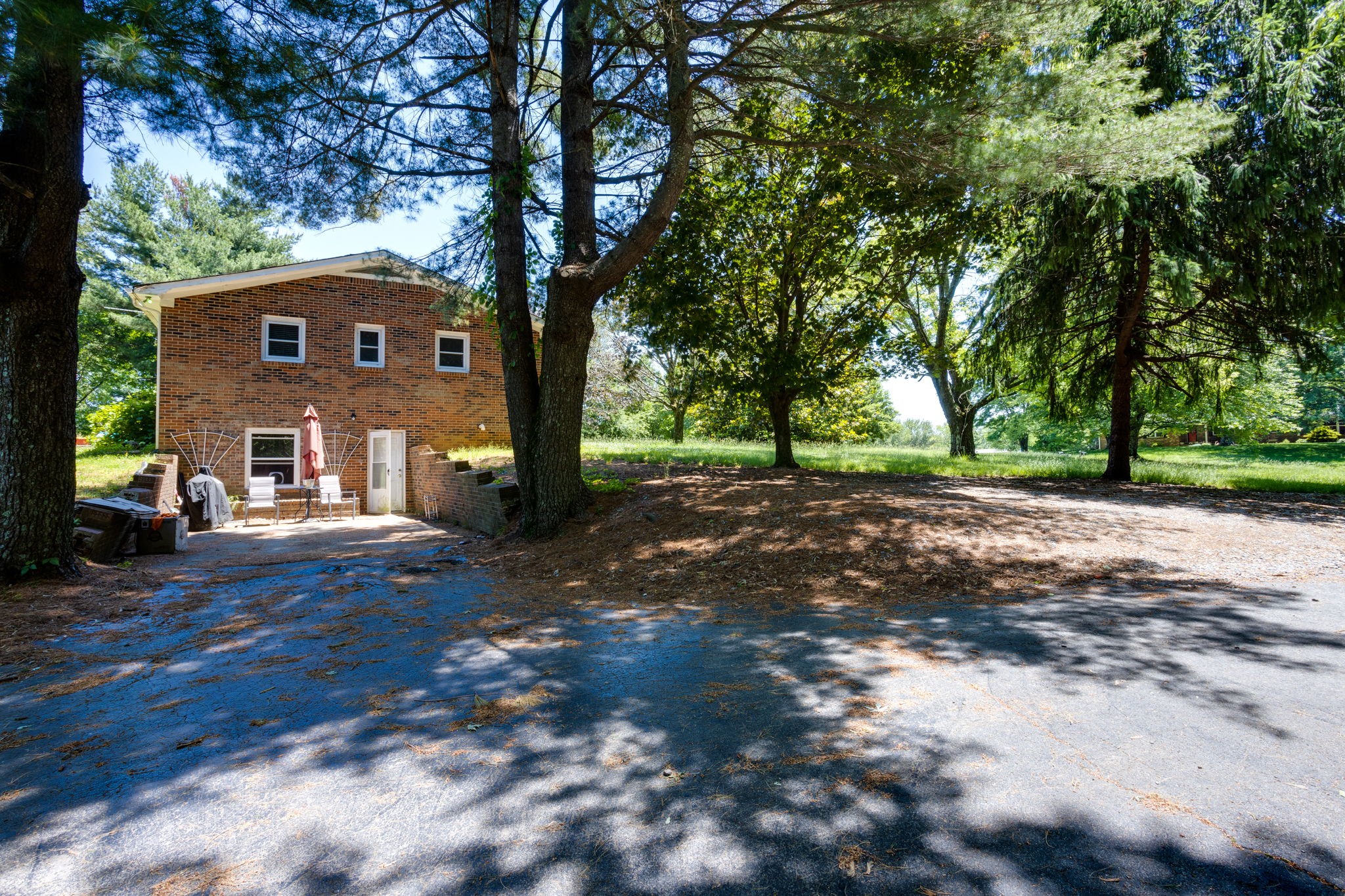 1151 Fowler Ford Road Portland, TN 37148 - Photo 29 of 35 a view of a yard in front of a house with large trees
