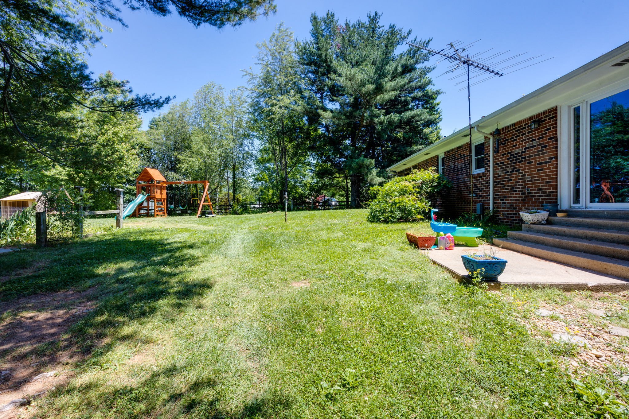 1151 Fowler Ford Road Portland, TN 37148 - Photo 30 of 35 a backyard of a house with seating space and trees