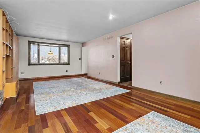 a view of an empty room and window