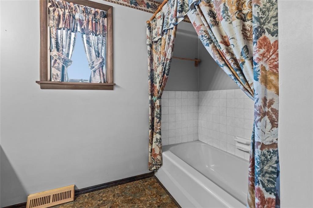 462 Adele Drive Irwin, PA 15642 - Photo 29 of 50 a bathroom with a bathtub and a shower