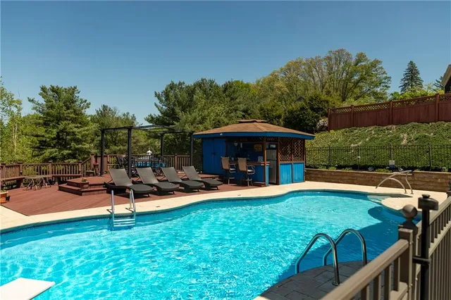 a view of a chairs and a table in the patio