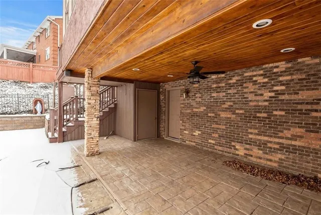 a brick building with a bench in front of it