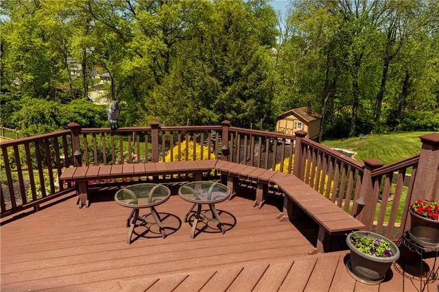 an outdoor view of a house with a garden