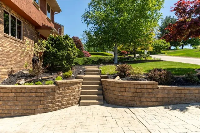 a view of a house with a snow in the yard
