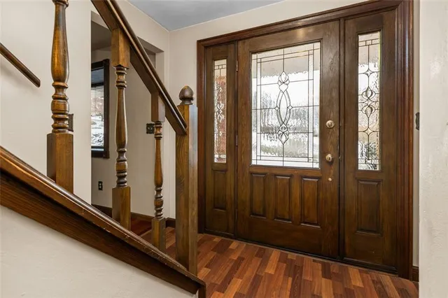 a bedroom with a bed dresser and a window