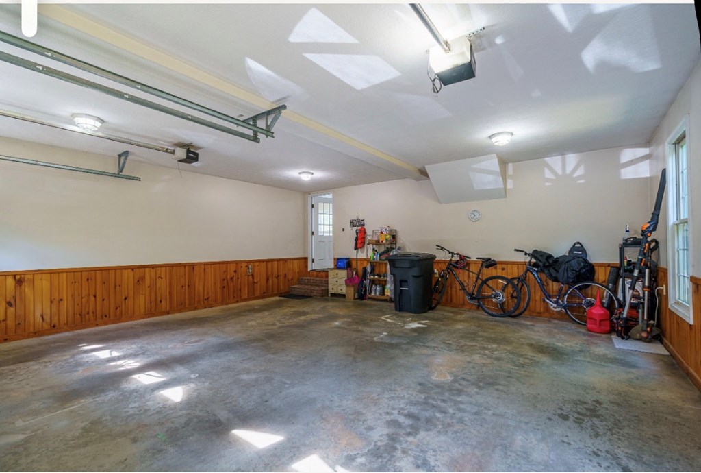 178 Windy Valley Lane Blue Ridge, GA 30513 - Photo 34 of 37 a view of a garage with a bike and car