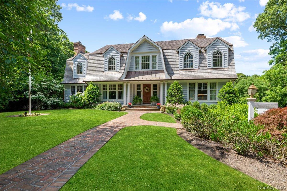 5 Fox Hunt Court Cold Spring Harbor, NY 11724 - Photo 1 of 42 Gabled-roof residence featuring light-toned siding and multiple dormer windows