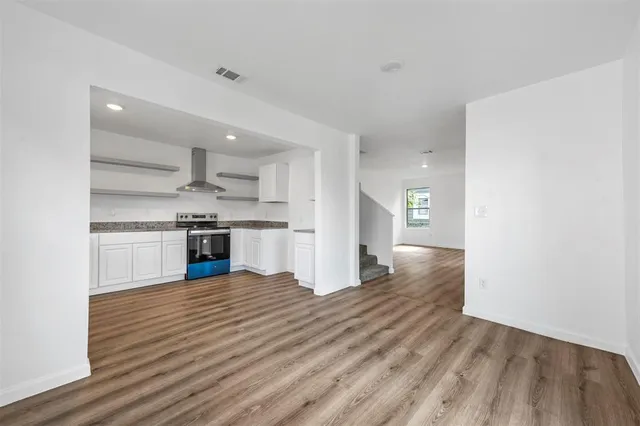 a view of kitchen with wooden floor