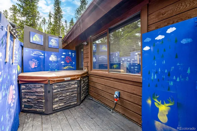 a view of outdoor sitting area with wooden floor