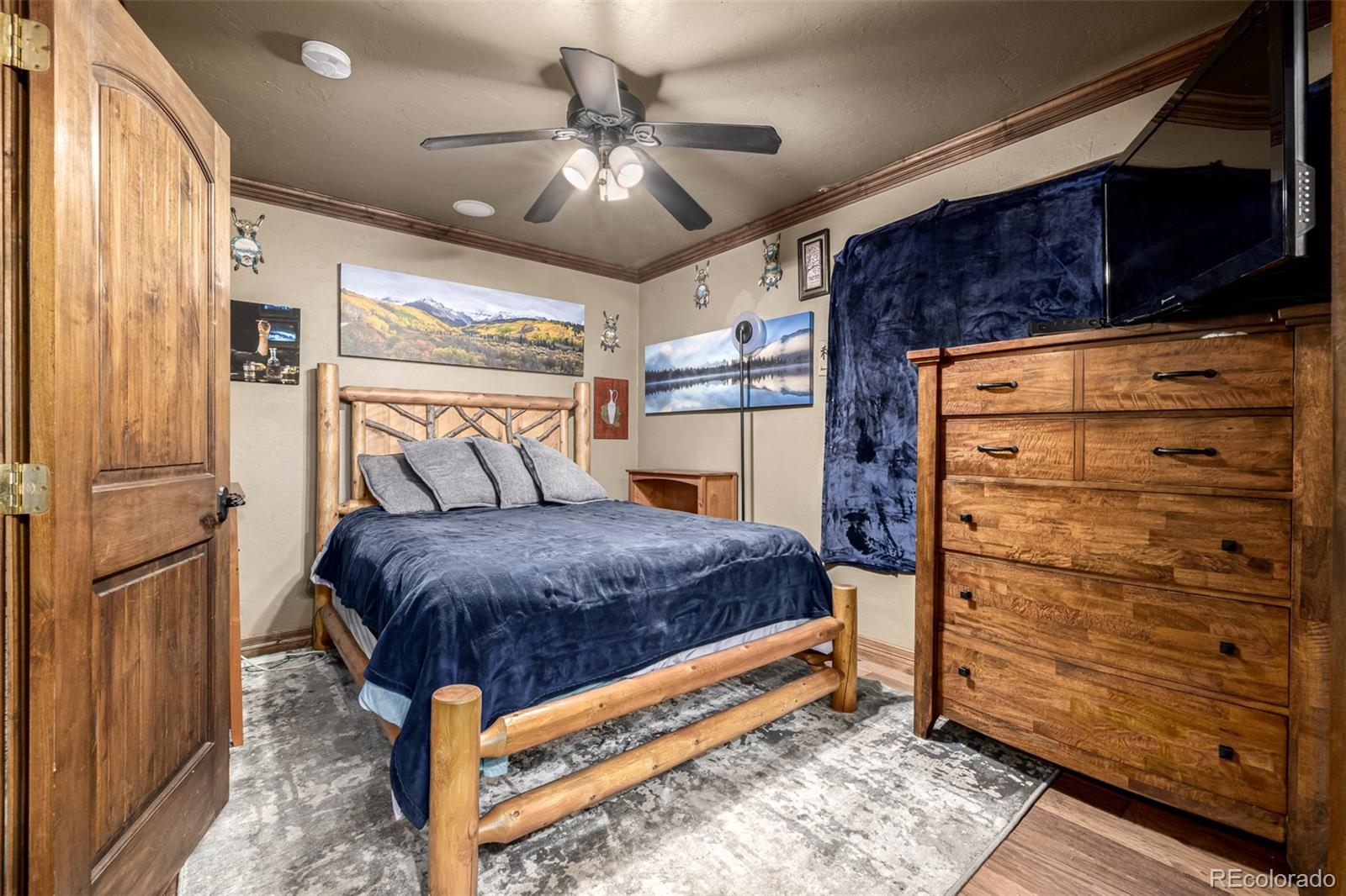 318 Upper Forest Road Idaho Springs, CO 80452 - Photo 8 of 24 a bedroom with a bed and a walk in closet