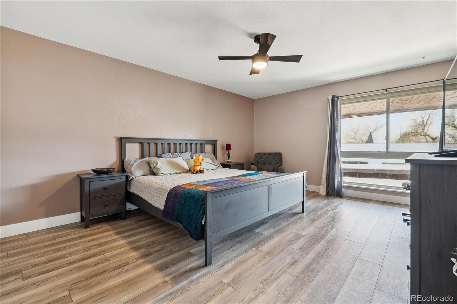 6495 East Happy Canyon Road, Unit 163 Denver, CO 80237 - Photo 15 of 27 a bedroom with a bed and a window