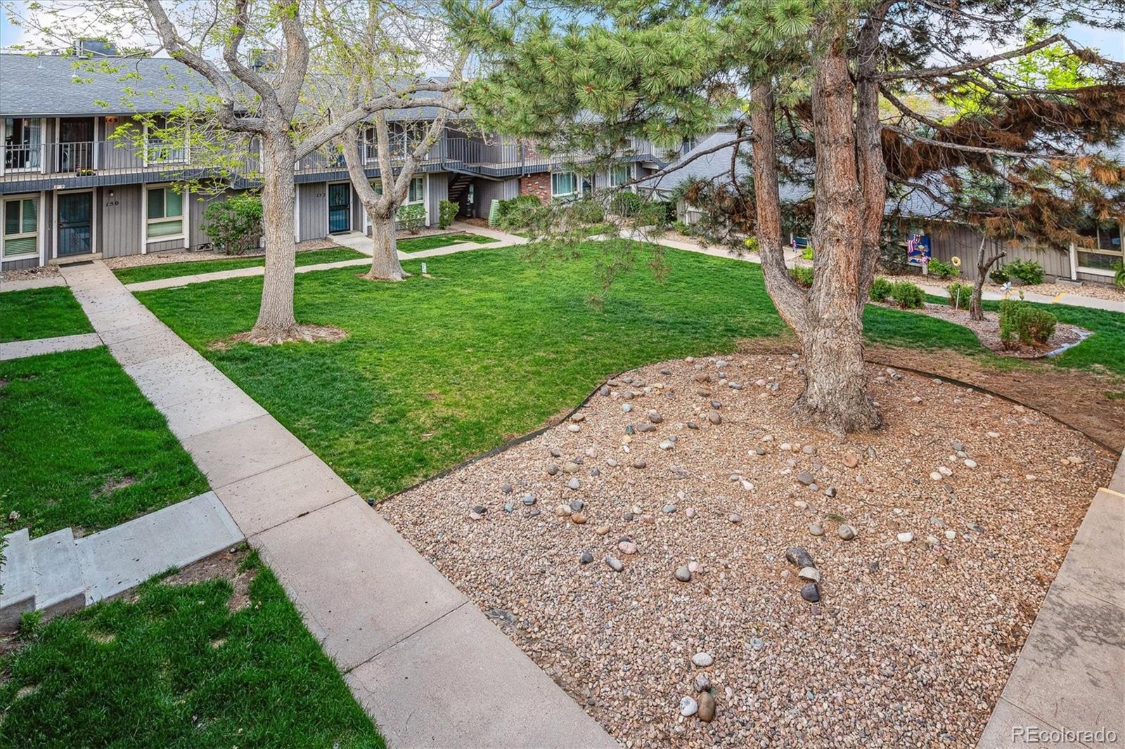 6495 East Happy Canyon Road, Unit 163 Denver, CO 80237 - Photo 25 of 27 a view of a house with a yard