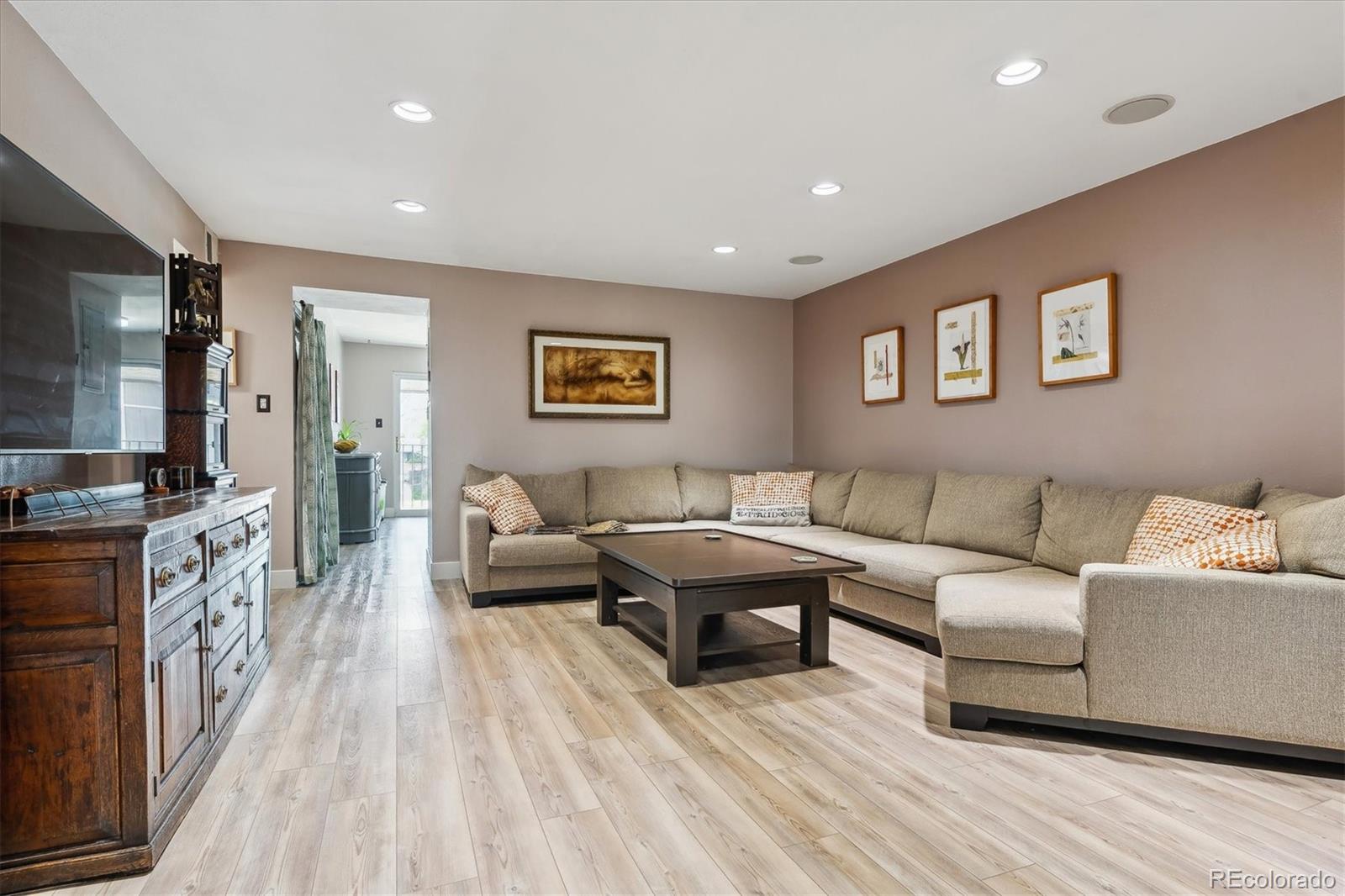 6495 East Happy Canyon Road, Unit 163 Denver, CO 80237 - Photo 7 of 27 a living room with furniture and a flat screen tv