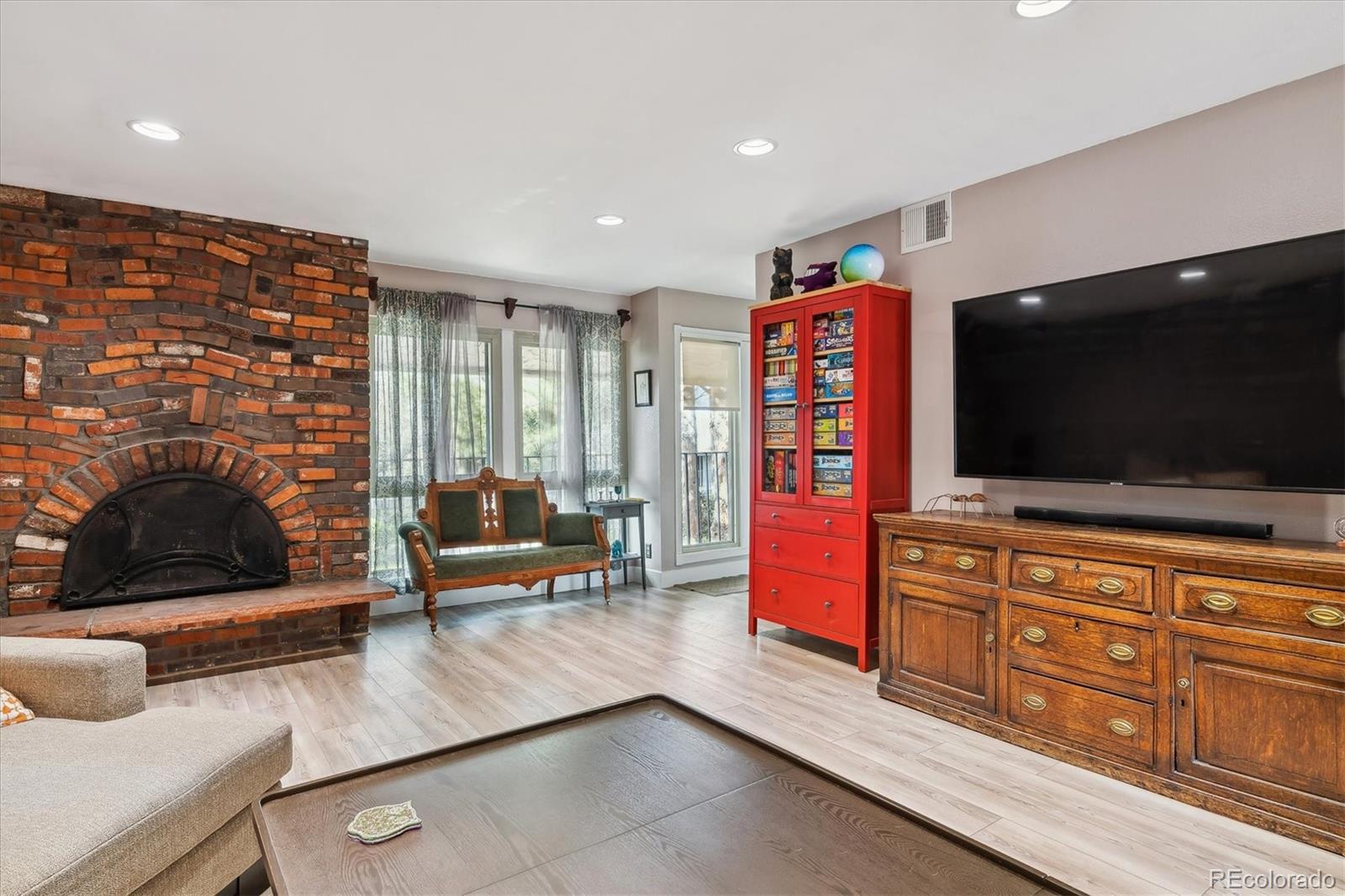 6495 East Happy Canyon Road, Unit 163 Denver, CO 80237 - Photo 8 of 27 a living room with furniture and a flat screen tv