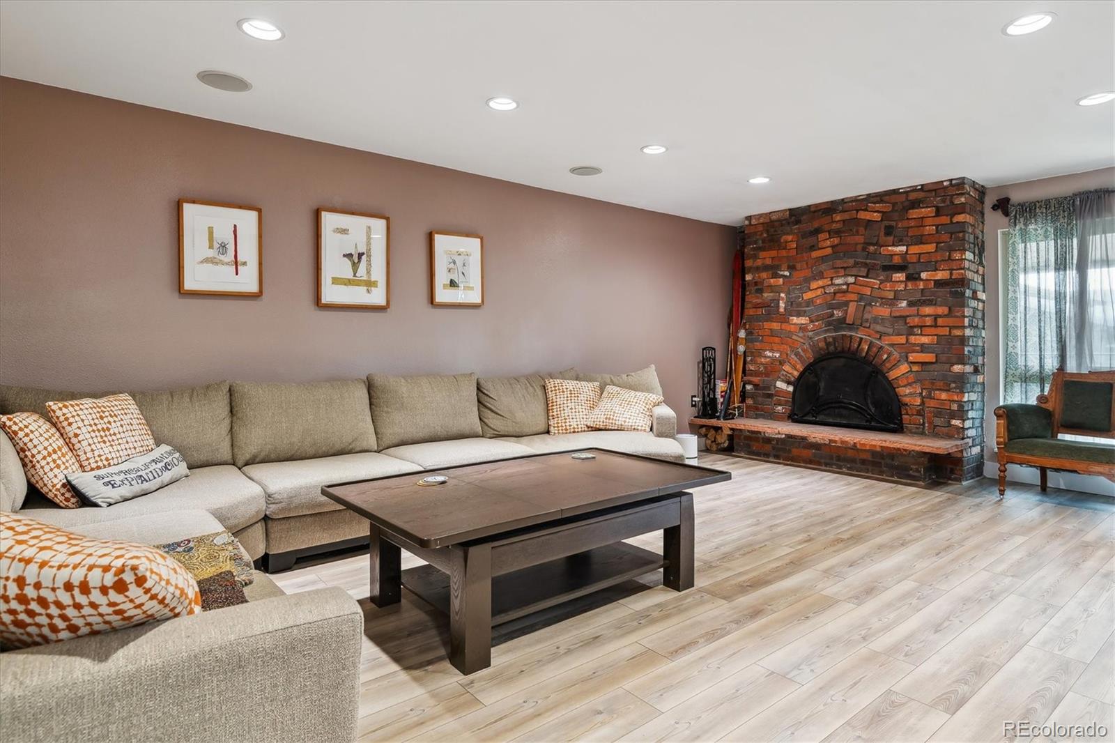 6495 East Happy Canyon Road, Unit 163 Denver, CO 80237 - Photo 9 of 27 a living room with furniture and a flat screen tv