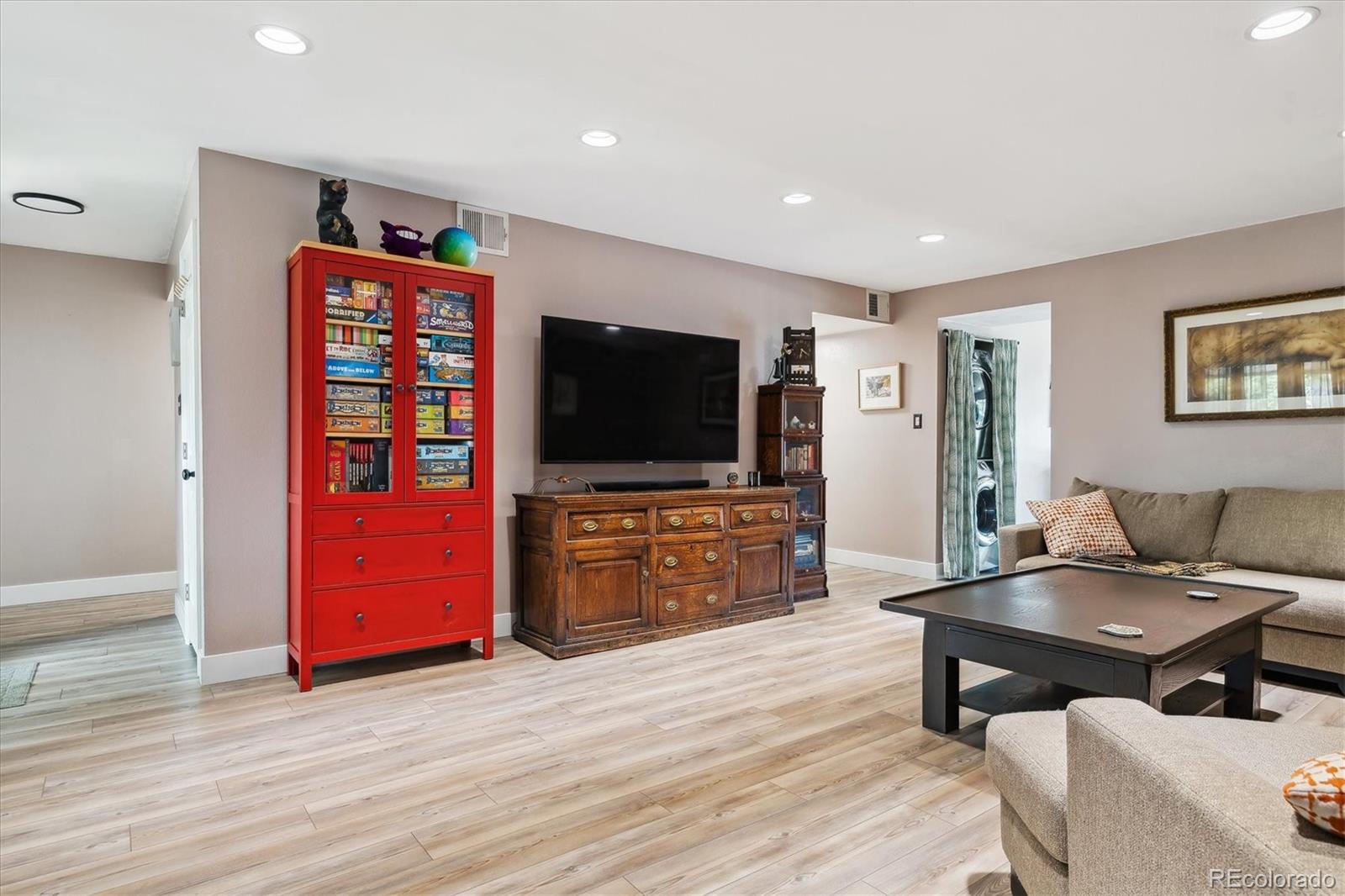 6495 East Happy Canyon Road, Unit 163 Denver, CO 80237 - Photo 10 of 27 a living room with furniture and a flat screen tv