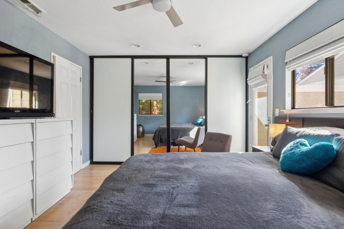 181 Ada Avenue, Unit 47 Mountain View, CA 94043 - Photo 14 of 32 a bedroom with furniture and large windows