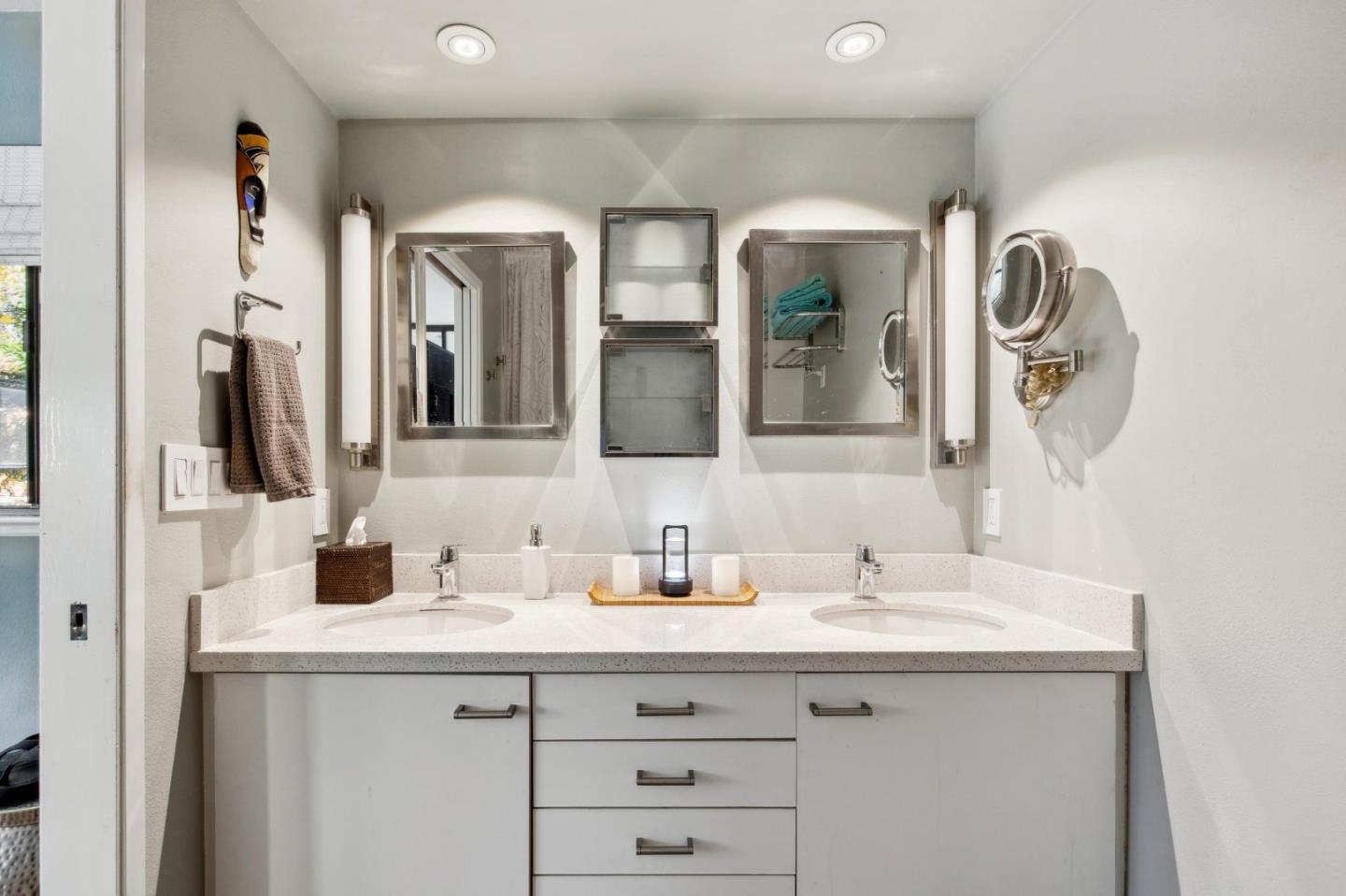 181 Ada Avenue, Unit 47 Mountain View, CA 94043 - Photo 15 of 32 a bathroom with a double vanity sink and a mirror