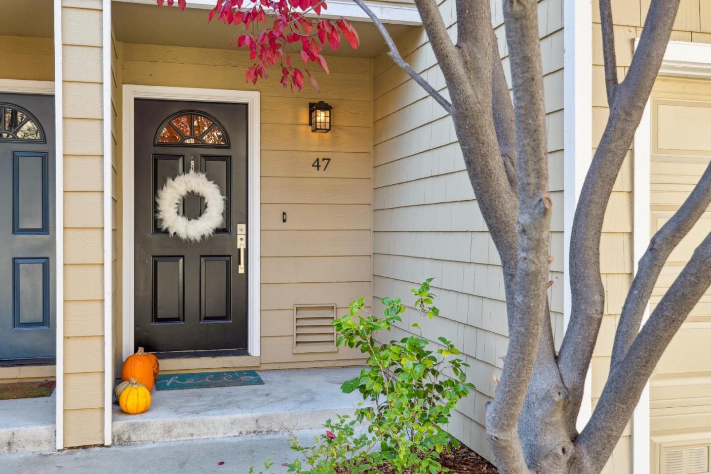181 Ada Avenue, Unit 47 Mountain View, CA 94043 - Photo 2 of 32 a front view of a house with potted plants