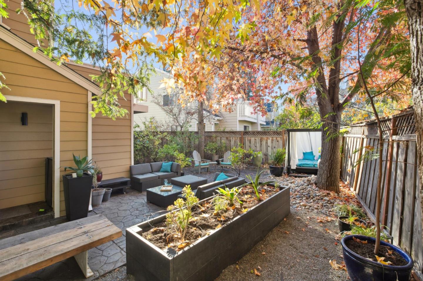 181 Ada Avenue, Unit 47 Mountain View, CA 94043 - Photo 28 of 32 a view of a patio with couches chairs and a potted plant