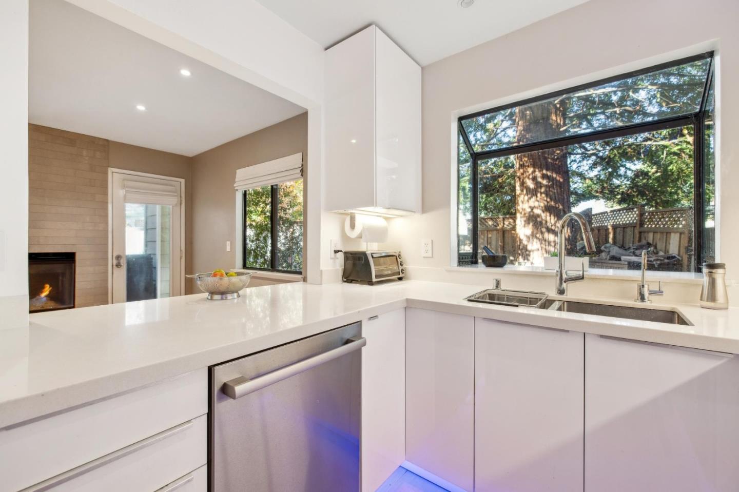 181 Ada Avenue, Unit 47 Mountain View, CA 94043 - Photo 3 of 32 a kitchen with a sink and large window