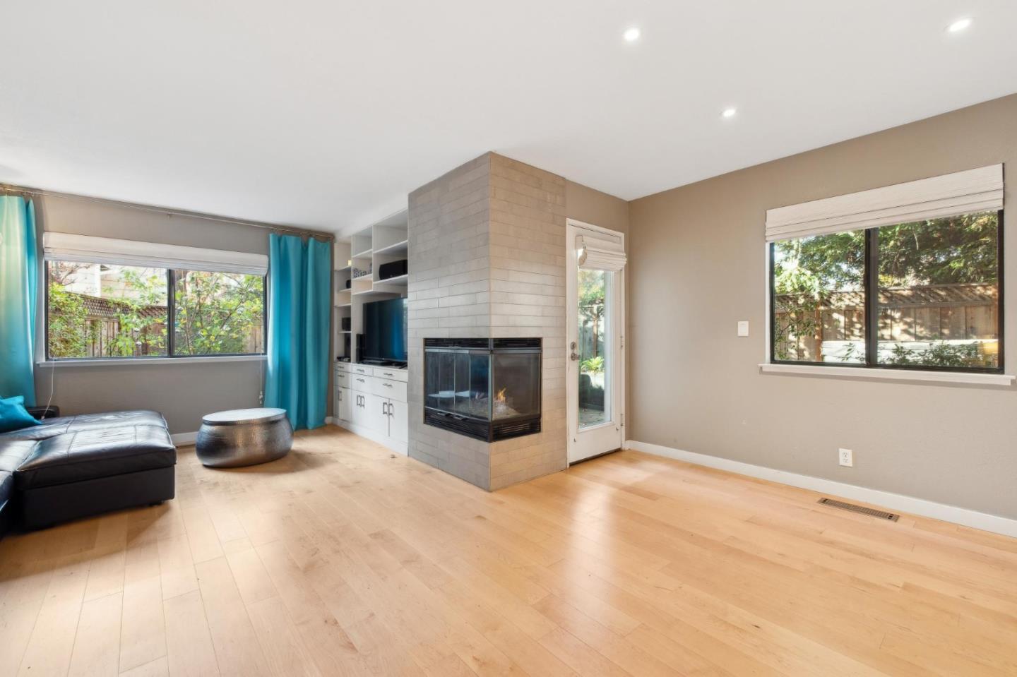 181 Ada Avenue, Unit 47 Mountain View, CA 94043 - Photo 8 of 32 a living room with furniture and a fireplace