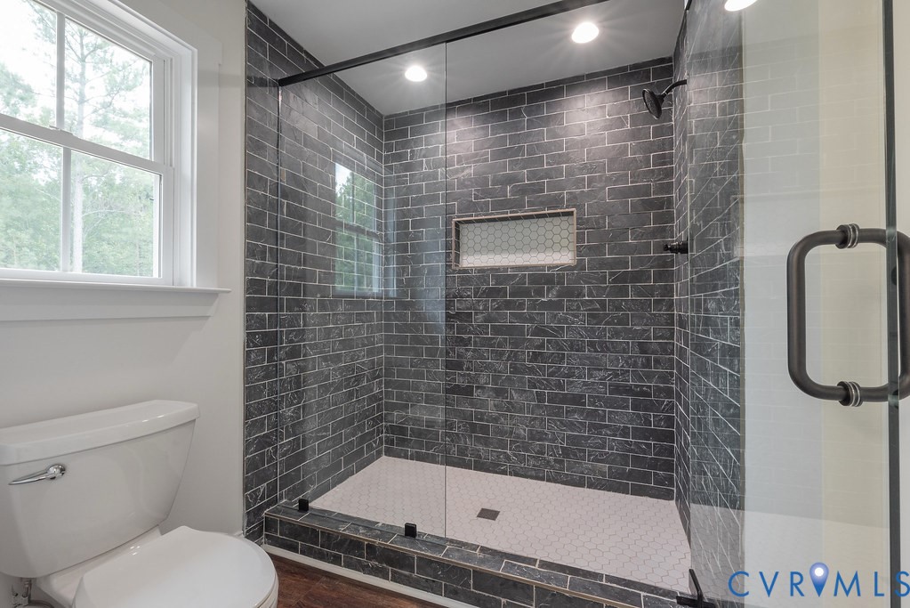 2355 Wickham Road Bumpass, VA 23024 - Photo 30 of 46 a bathroom with a shower and a toilet