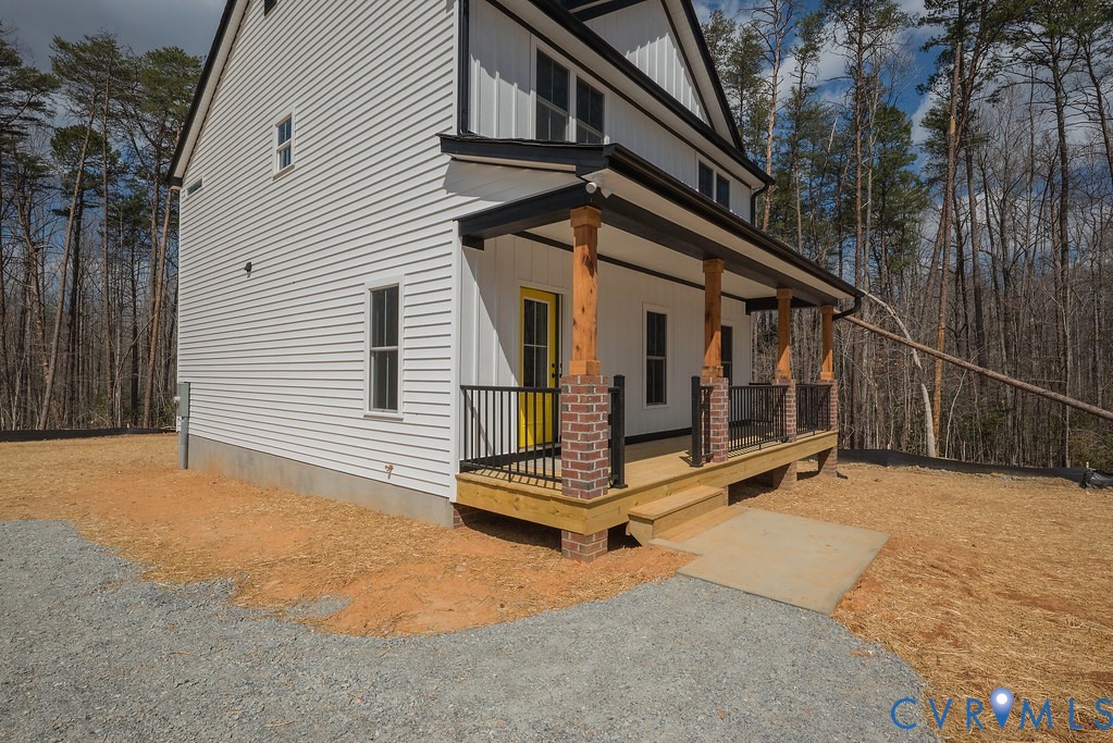 2355 Wickham Road Bumpass, VA 23024 - Photo 8 of 46 a view of backyard with a large tree