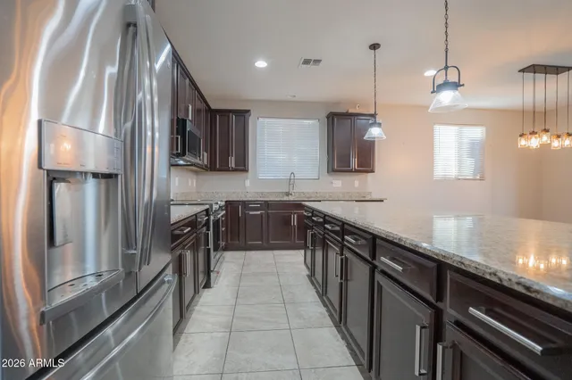 an empty room with ceiling fan and window