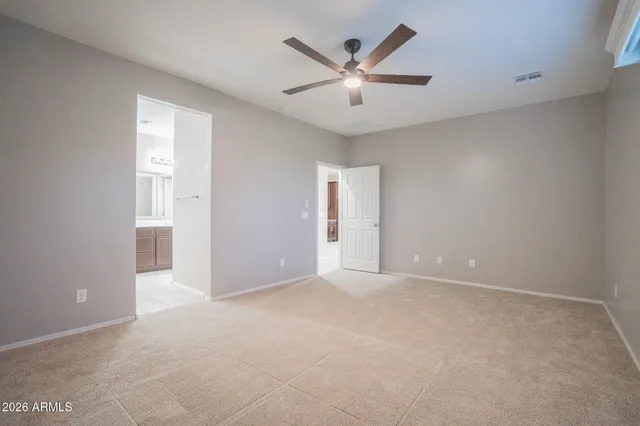 a bathroom with a bathtub sink vanity and mirror