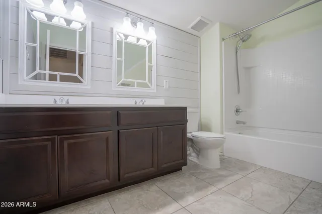 a view of a house with pool and chairs