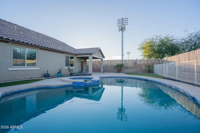 a view of swimming pool with a patio