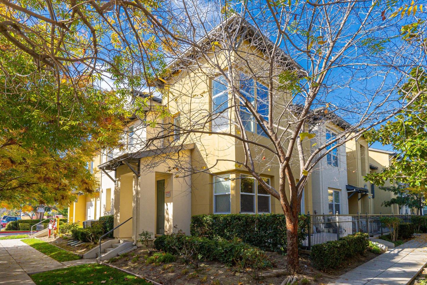 a front view of a house with a yard
