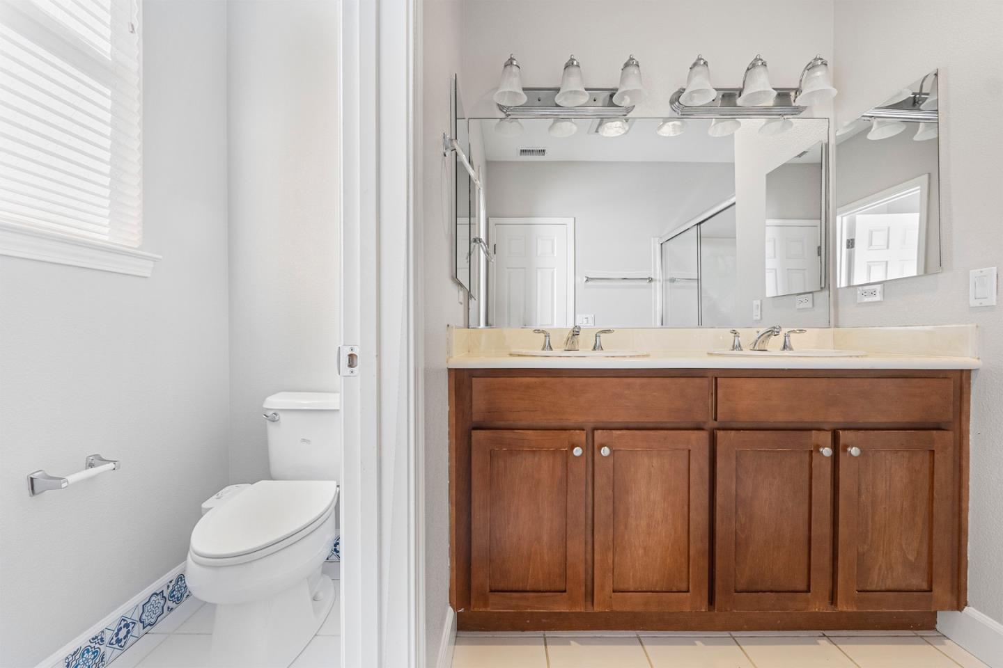 2102 Klassen Way San Jose, CA 95131 - Photo 16 of 31 a bathroom with a sink vanity mirror and toilet