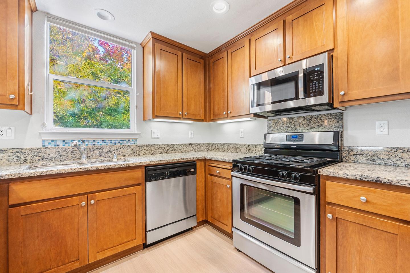 2102 Klassen Way San Jose, CA 95131 - Photo 8 of 31 a kitchen with granite countertop white cabinets stainless steel appliances and a window